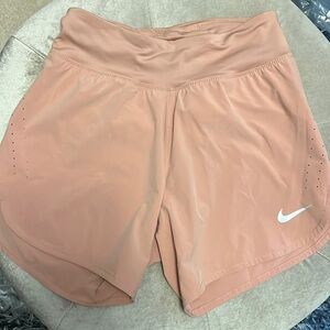 Nike dry fit workout shorts in a light peach color